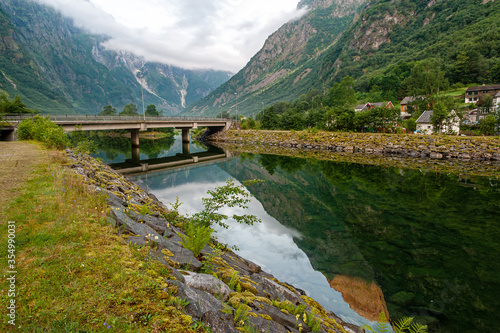 Beautiful idyllic mountain landscape. Gudvangen is a popular tourist village located at the very beginning of the Neroifjord. photo