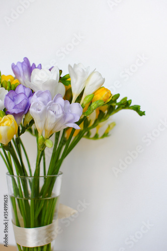 Fototapeta Naklejka Na Ścianę i Meble -  Colorful freesias bouquet on white background