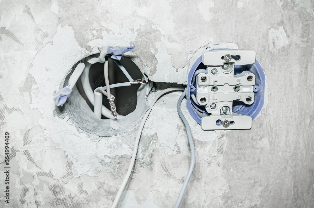 Foto de Closeup of holes for installing an electrical outlet and