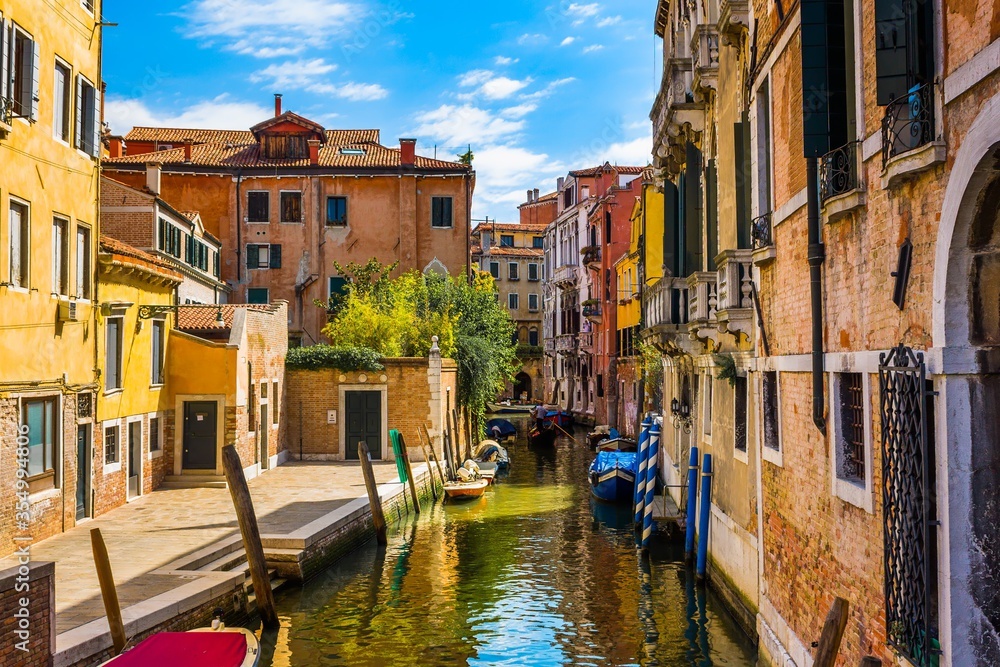 Venice - colorful canal with surrounding traditional venetian architecture