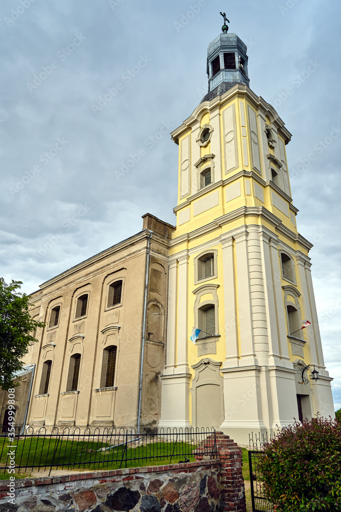 The facade of the baroque parish church in the village of Lutom in Poland.