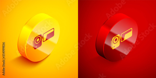 Isometric Cinema camera icon isolated on orange and red background. Video camera. Movie sign. Film projector. Circle button. Vector Illustration