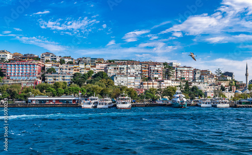 Wallpaper Mural Cityscape of Üsküdar with colorful buildings, little mosque and pier with moored boats during the daytime. Üsküdar, Istanbul, Turkey Torontodigital.ca