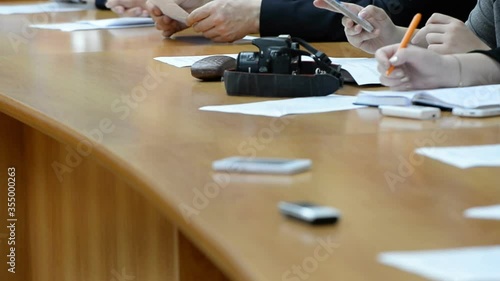 Hands of an official, businessman serving on the table. Meeting
