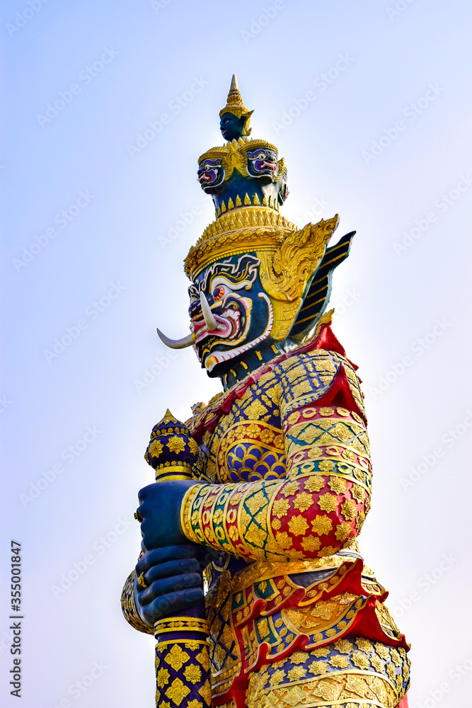 Giant guardian statue in Bangkok Thailand on blue sky  background