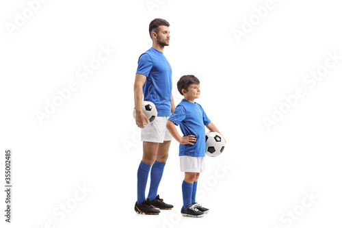Adult and child football players in identical outfit