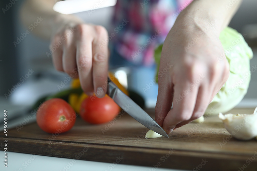Female hands cut fresh vegetables table in kitchen Female hands cut fresh vegetables table in kitchen
