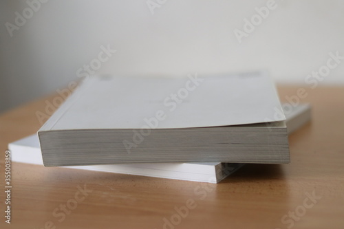 Books, Thick heavy books with white paper and hard cover, good binding, perfect binding, large number of pages, huge page booklet on table