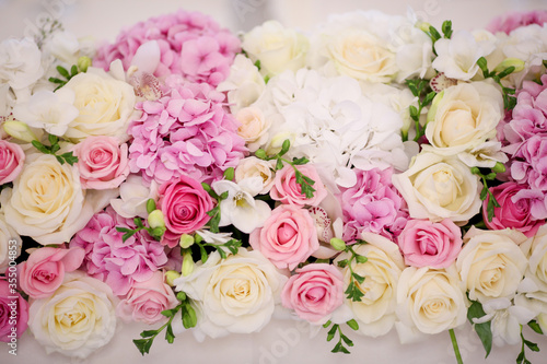 beautiful wedding arrangement with roses and other flowers