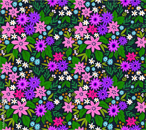 Seamless floral pattern for design. Small multicolored flowers. Dark blue background. Modern floral texture. A allover floral design in bright colors. The elegant the template for fashion prints. 