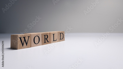 World word made of wooden cubes in white background.