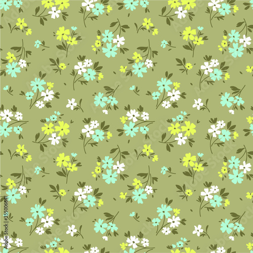 Cute floral pattern in the small flower. Ditsy print. Motifs scattered random. Seamless vector texture. Elegant template for fashion prints. Printing with small colorful flowers. Beige background.