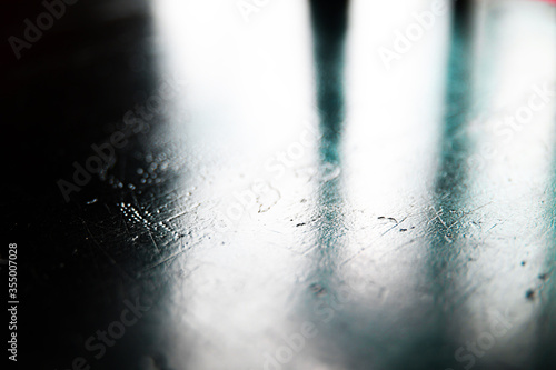 abstract reflectively lit background of scratched surface