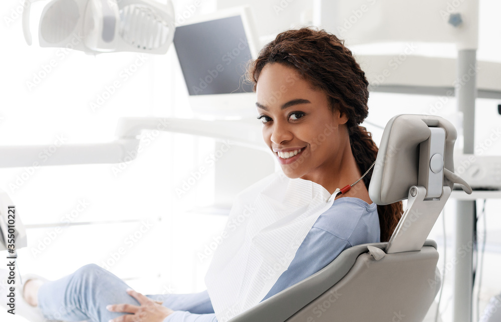 Happy black girl attenting modern dental clinic Happy black girl attenting modern dental clinic