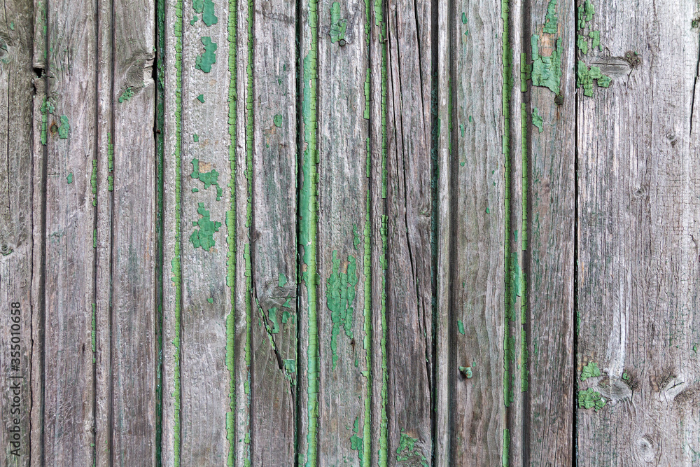 Wooden boards with the remains of old green paint Wooden boards with the remains of old green paint