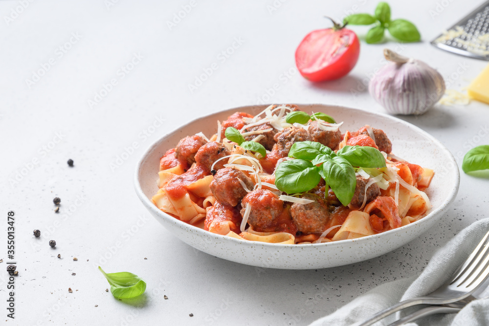 Pasta fettuccine with meatballs, parmesan, tomatoes, basil. Pasta fettuccine with meatballs, parmesan, tomatoes, basil.