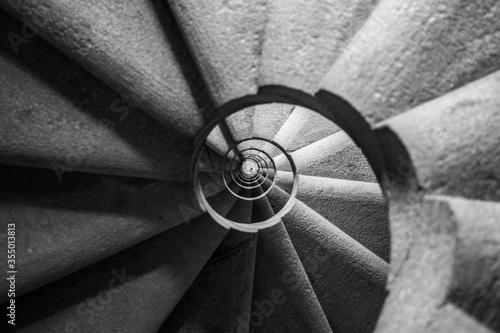 Photography Winding and spiralling concrete staircase in a tower, with infinity point