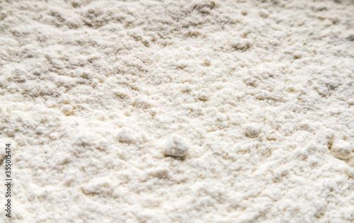 Close up of white flour. Food background. Top view, from above.