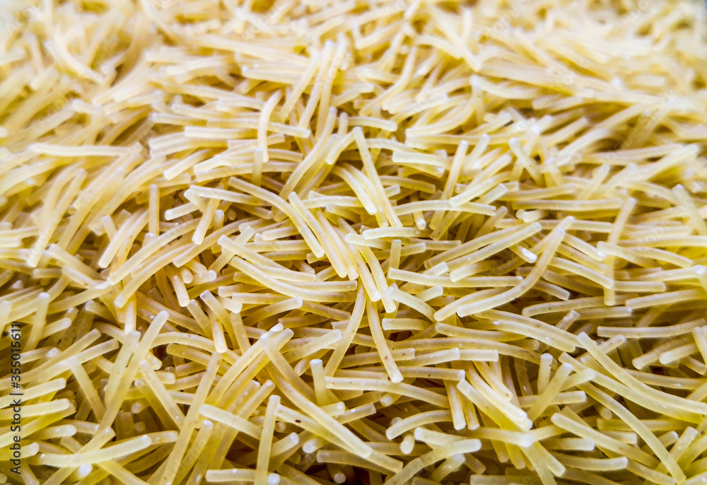 Close up of uncooked vermicelli pasta. Food background. Top view, from above. Close up of uncooked vermicelli pasta. Food background. Top view, from above.