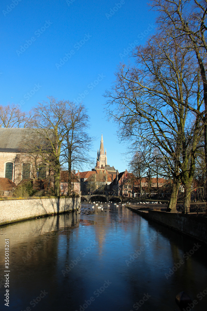 Famous Bruges' city canals. Waterfront buildings in Brugge, Belgium.