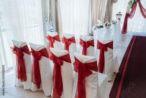Beautifully decorated and arranged chairs for a festive Banquet. Decor, wedding
