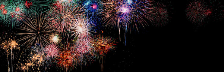 Colorful holiday festival celebration fireworks in Happy New Year 2025 with blank copy space for banner.