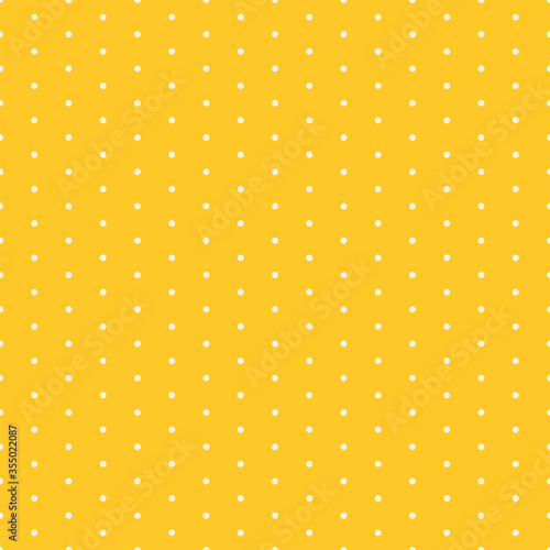 Yellow seamless pattern with white dots