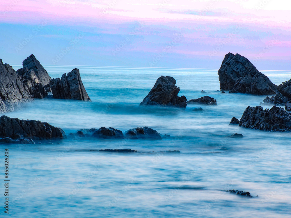 rocks and sea at sundown in North Devon rocks and sea at sundown in North Devon