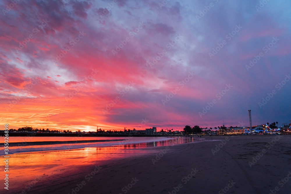 Incredible red sunset in Santa Cruz. Red sky on the beach in California
