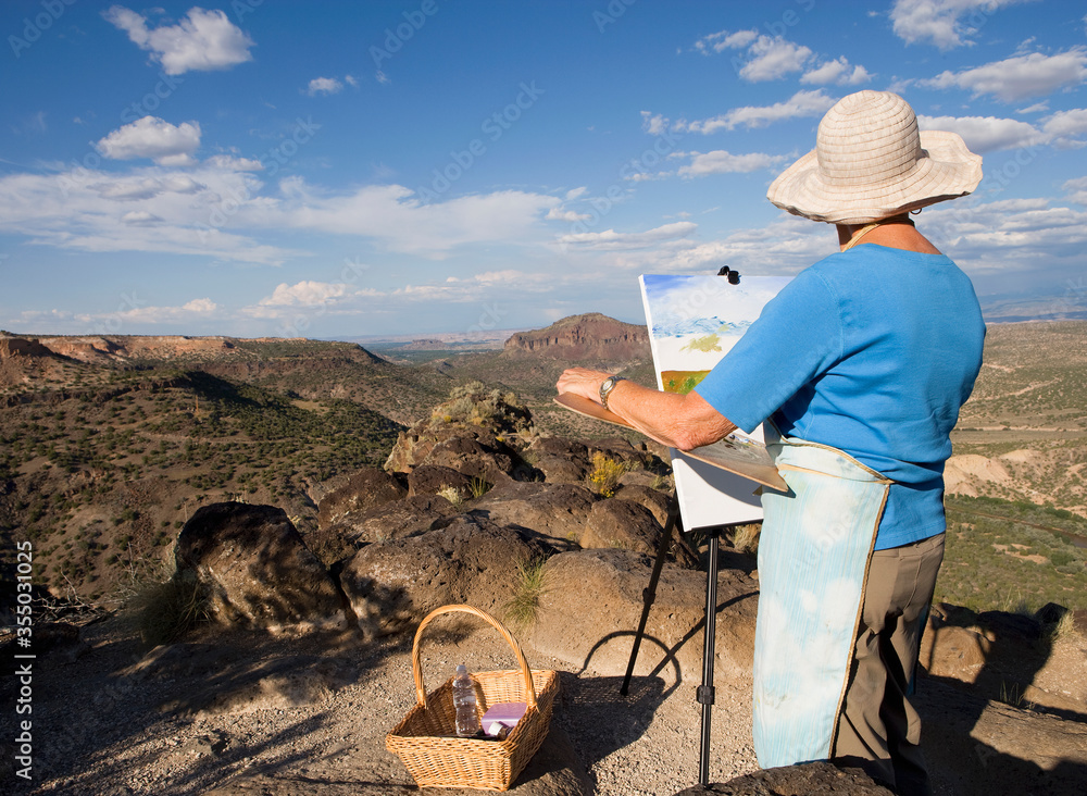 senior woman artist painting landscape, White Rock, New Mexico senior woman artist painting landscape, White Rock, New Mexico