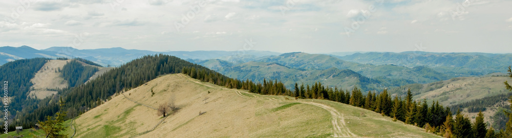 Carpathian Mountains top view landscape ridge summer season dramatic weather time with cloudy blue sky background