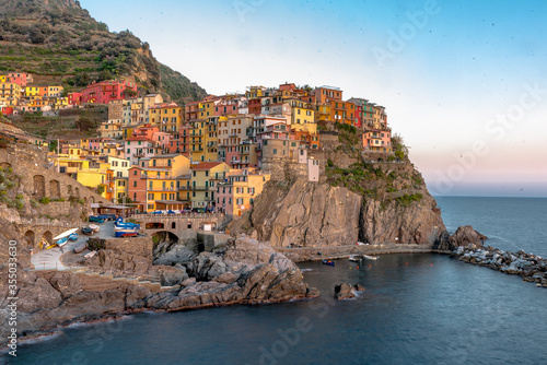 Panoramic landscape during sunset of colourful housings of Manarola village in Cinque Terre near La Spezia in Italy