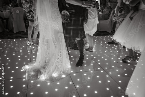 Photos Bride and grooms feet on light up dancefloor