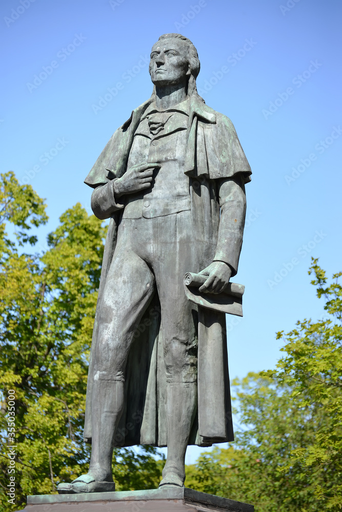 Statue of German poet Friedrich Schiller (1910). Kaliningrad. Russian, German text
