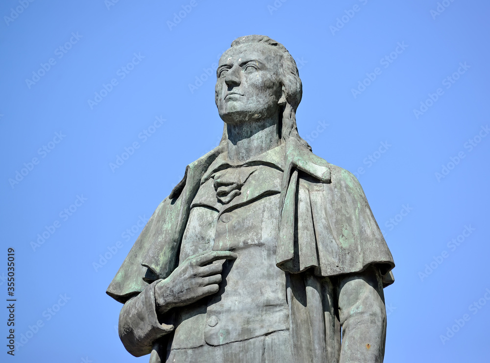 Fragment of a monument to the German poet Friedrich Schiller against the background of the blue sky (1910). Kaliningrad