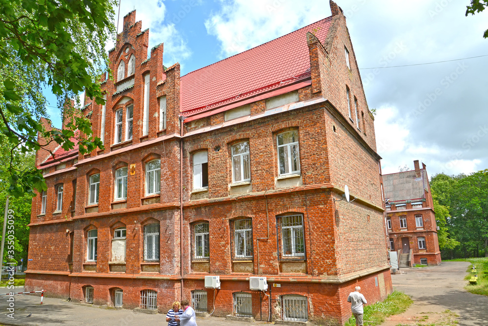 SOVETSK, RUSSIA. Side facade of the central city hospital (former House of the Poor, 1908). Kaliningrad region