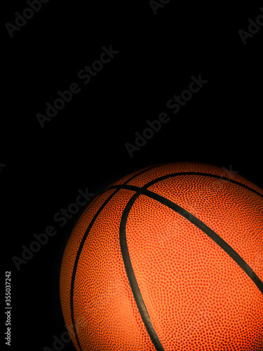 Basketball isolated on a black background as a sports and fitness symbol of a team leisure activity