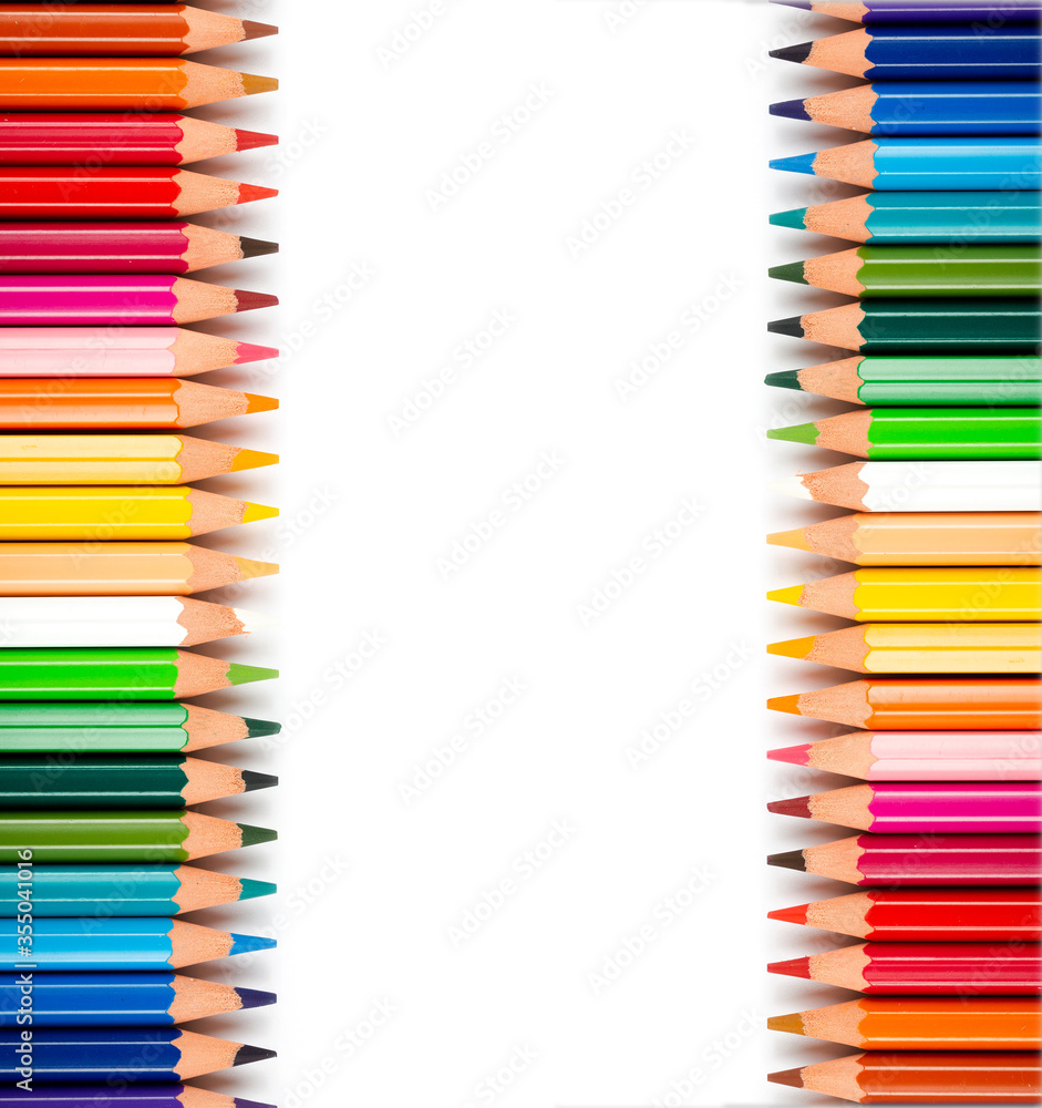 Multicolored pencils isolated on a white background. Free space for text. Education frame concept. Multicolored pencils isolated on a white background. Free space for text. Education frame concept.