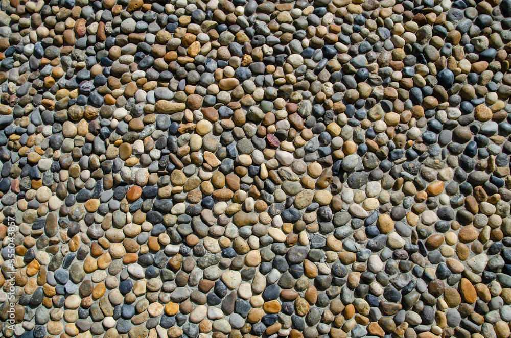 Pebble wall texture. Stone wall made of pebbles Pebble wall texture. Stone wall made of pebbles