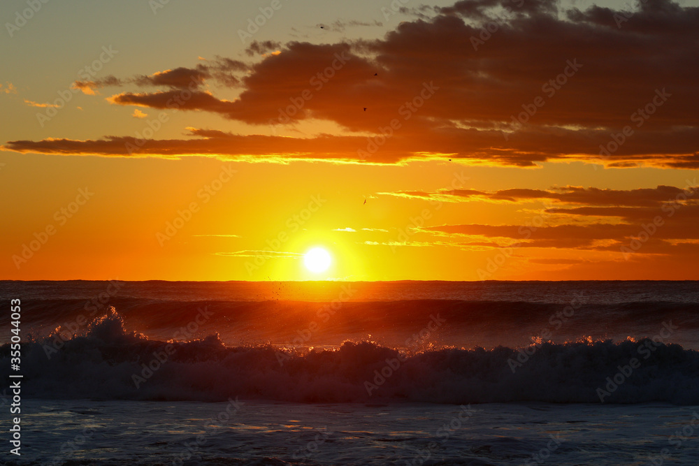Fototapeta premium Beach sunrise in Japan, Chiba, Land of the rising sun, Hebara beach is famous for being one of the first places to see the sunrise in Japan.