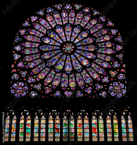 PARIS, FRANCE - SEPTEMBER 26, 2018 North Rose vitrages stained glass window in interior of cathedral Notre-Dame de Paris before fire April 15, 2019. Paris, France