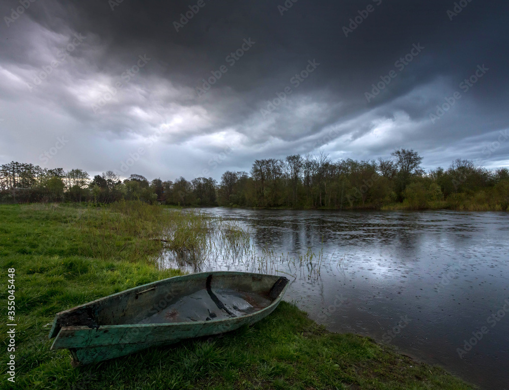 old boat on the river bank