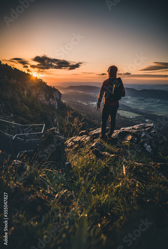 Man on top of mountain during Sunset in Summer