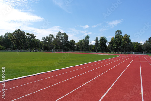 The corner of the red running track in the local stadium.