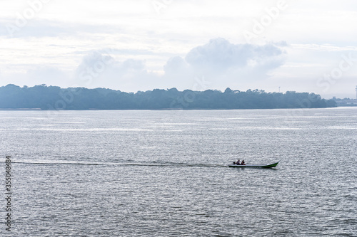 Fisherman Boat On A River in Amazon Rainforest Region