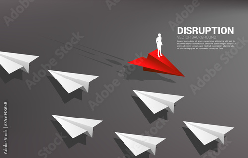 Silhouette of businessman standing on red origami paper airplane go different way from group of white. Business Concept of disruption and vision mission.