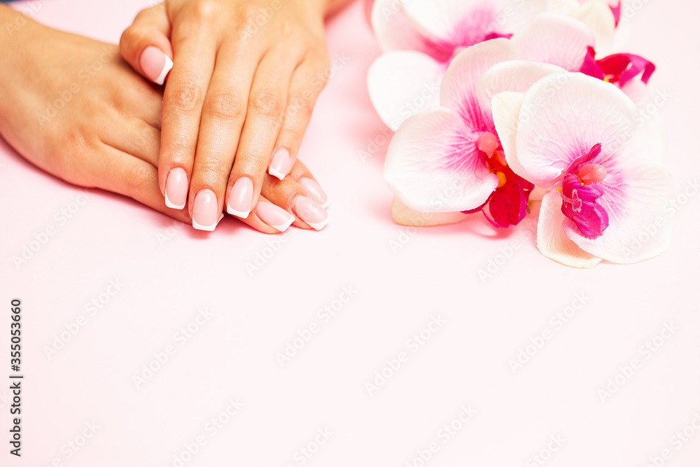 Beautiful woman hands with fresh french manicure