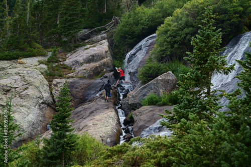 Male Jumper who jumps across a fast moving mountain stream 