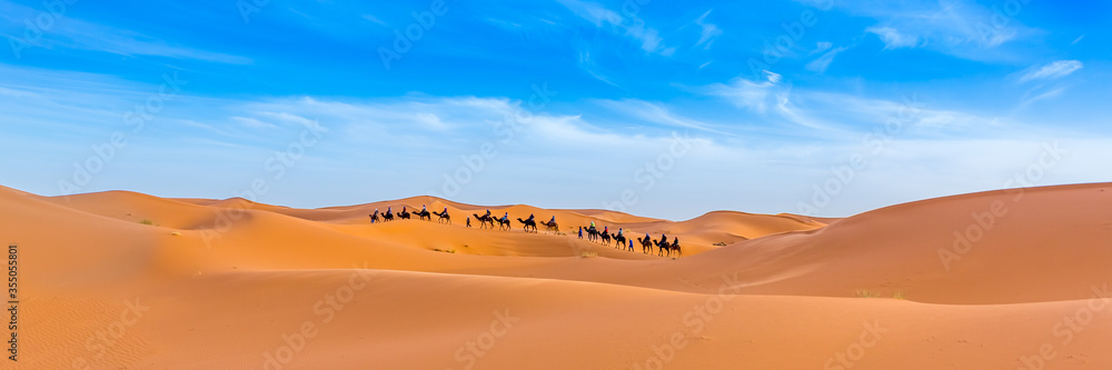 Merzouga in the Sahara Desert in Morocco. Web banner in panoramic view.