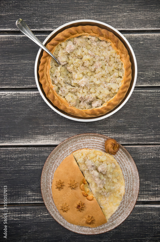 Potato Pie on the wooden table with opened top Potato Pie on the wooden table with opened top